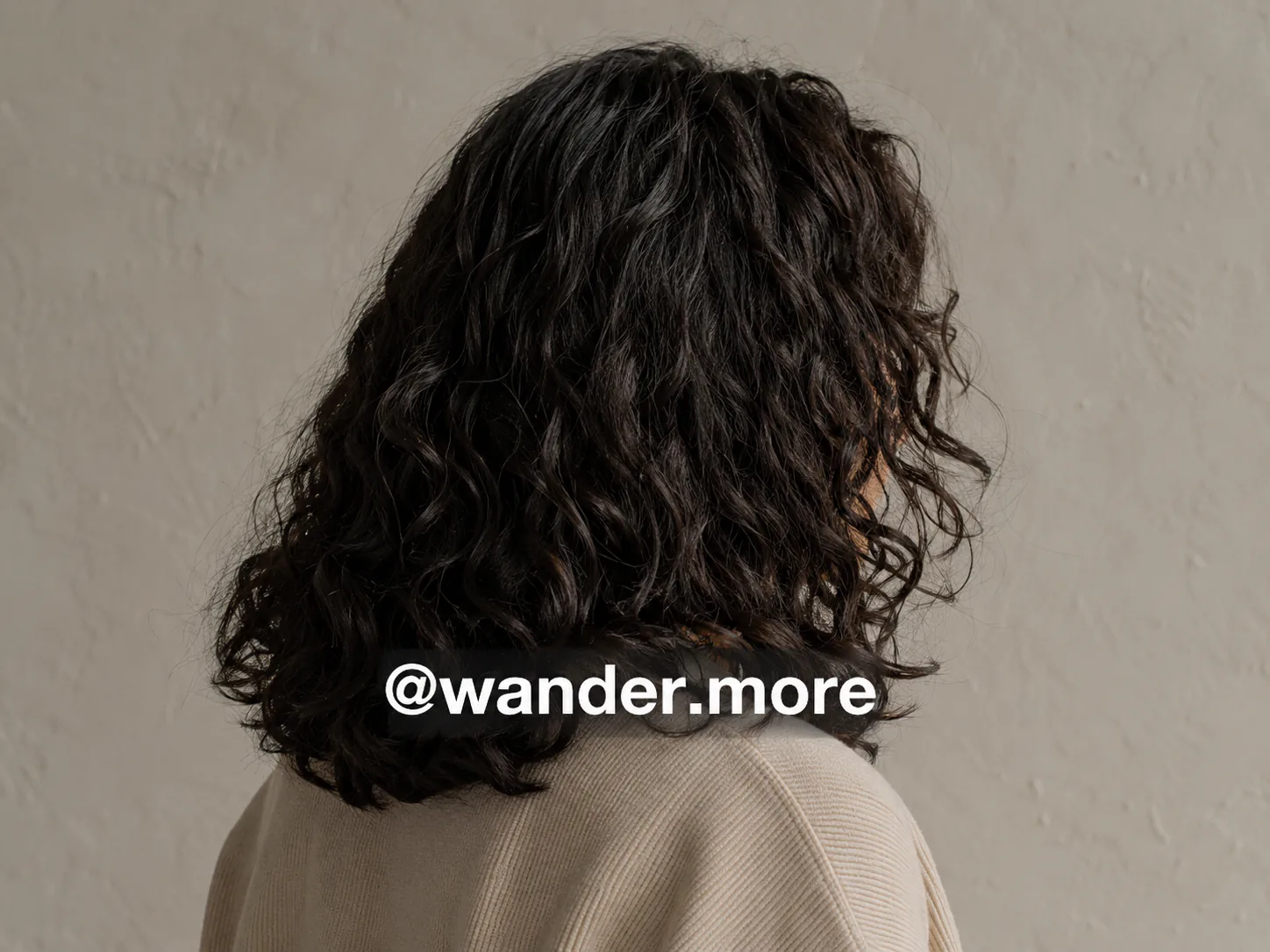 Synthetic authorized input: Synthetic portrait with a fictional social handle crossing hair and clothing, before and after an authorized AI-assisted edit